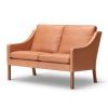 2208 2 pers. sofa i cognac læder, flot og har en stramt defineret kontur